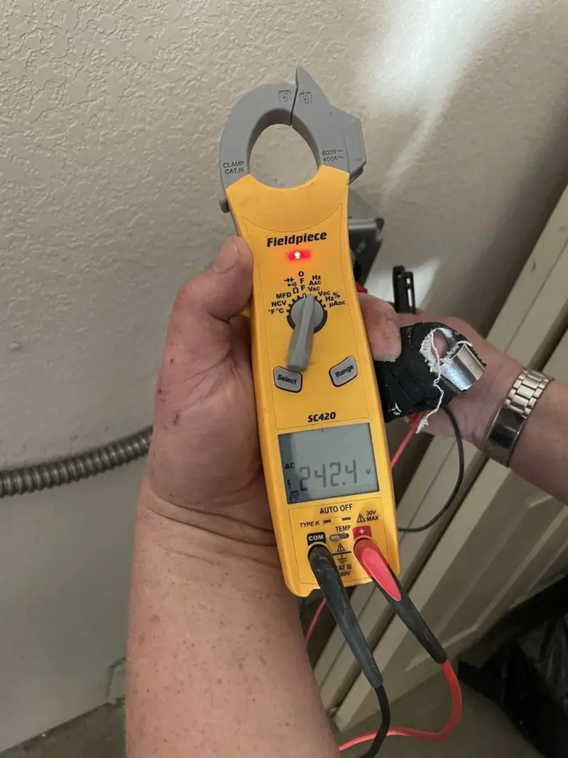 Voltage testing with clamp meter during Circuit Breaker Repair in Framingham